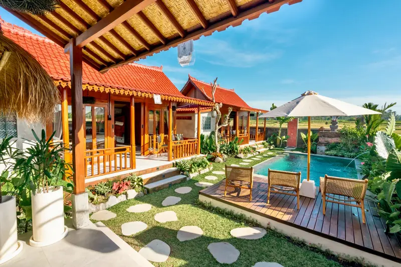 Joglo Hati: garden path with stepping stones to the pool