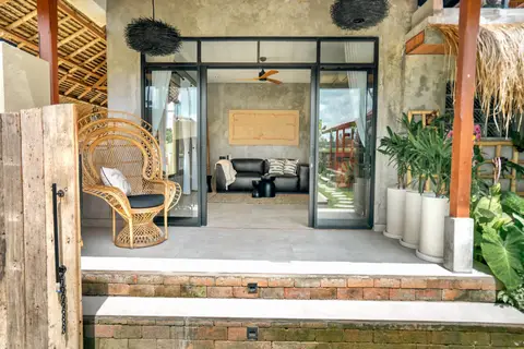 Joglo Hati: open living room with glass doors to the garden