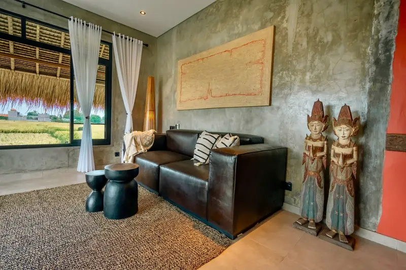 Joglo Hati: living room with Balinese wood carvings