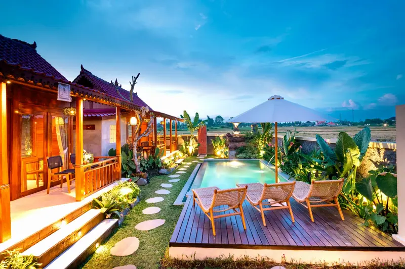 Joglo Hati: pool and veranda at dusk