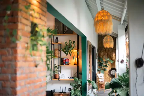Villa Mint Satu: brick wall and rattan lamps in the living area