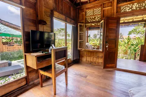 Rumah Richard: desk and TV in the first cottage