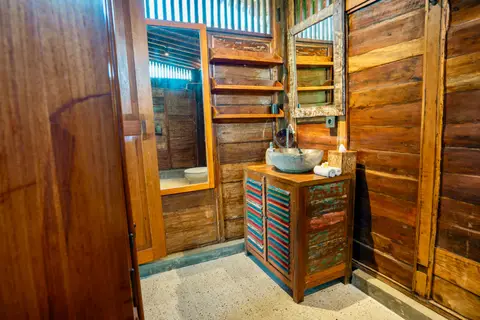 Rumah Richard: wooden washstand in the first bathroom