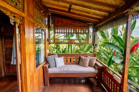 Rumah Richard: daybed on the veranda of the second cottage