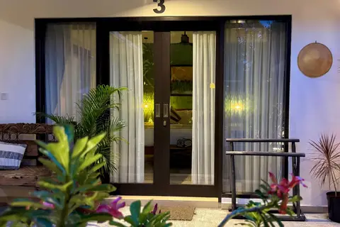 Villa Mint Dua: glass doors of a bedroom at night